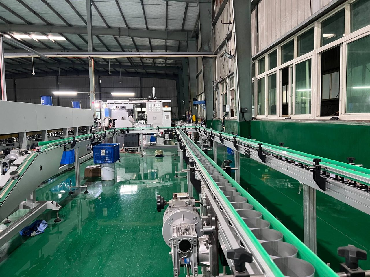 Conveyors carrying empty cans through the in-house can-making hall